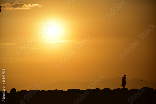 sunset with child shadow