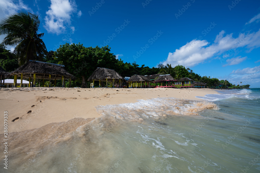 Beach fale's on a white sand beach on Lalomanu, Samoa