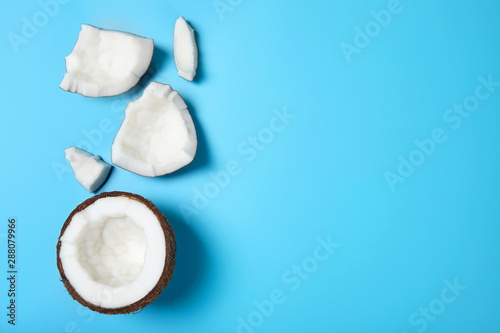 Fresh ripe coconut on blue background.