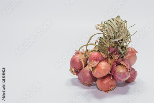 red onions on wooden background