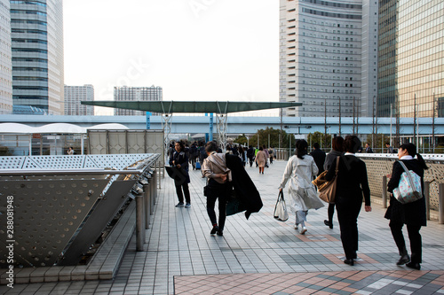 Japanese people and foreigners worker walking go to trains and bus station after finished work at tokyo big sight in Ariake at Koto city in Tokyo, Japan photo
