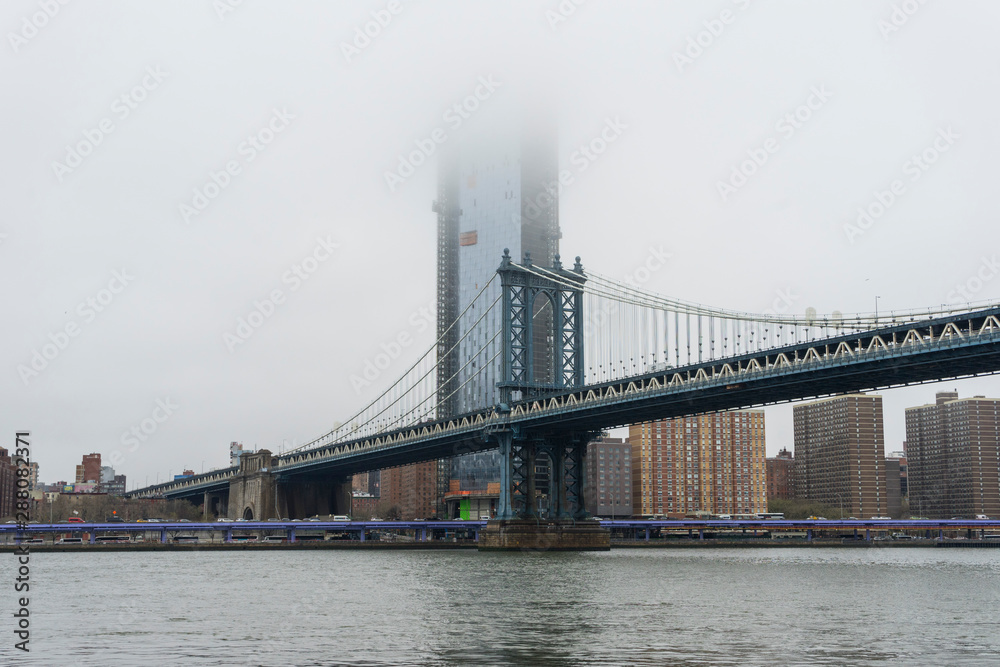 Manhattan Bridge and Manhattan skyline on gloomy day
