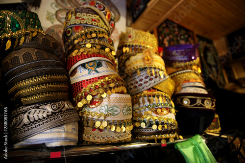 East skullcap in souvenir shop market. Selective focus 