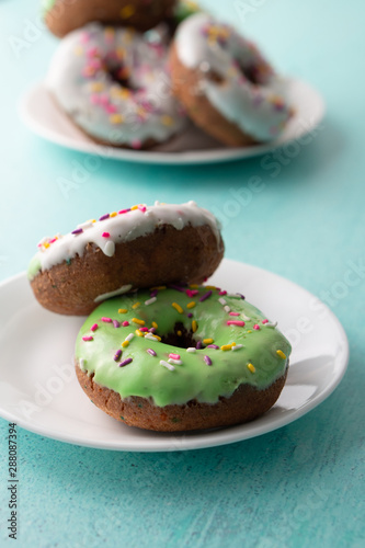 White and green Sprinkled delicious doughnuts. © MikeFusaro