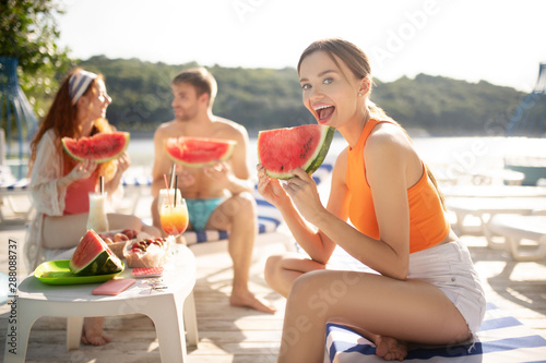 Young woman feeling excited before trying watermelon