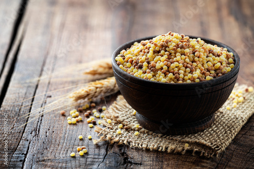 Fregola sarda . traditional durum wheat ball shaped toasted pasta typical of Sardinia region of Italy photo