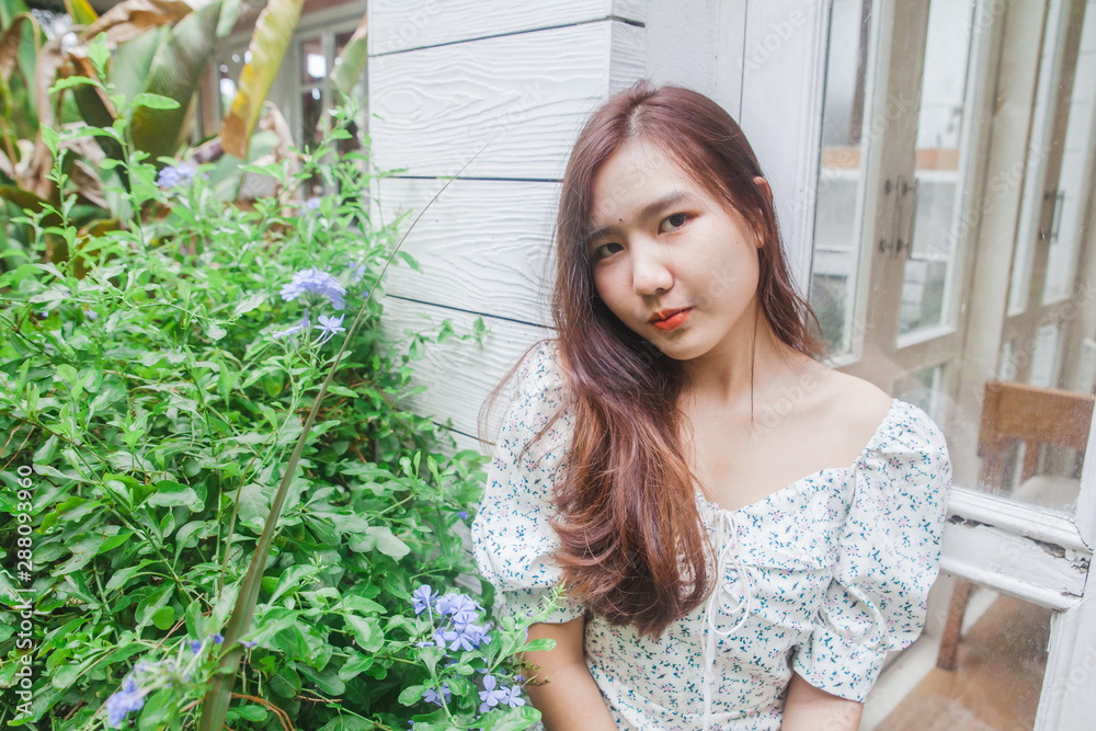 Asian woman relaxing at nature garden . Asian woman relaxing at nature garden .
