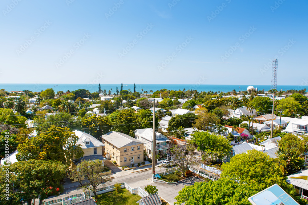 Obraz premium The historic and popular center and Duval Street in downtown Key West. Beautiful small town in Florida, United States of America. With colorful houses.
