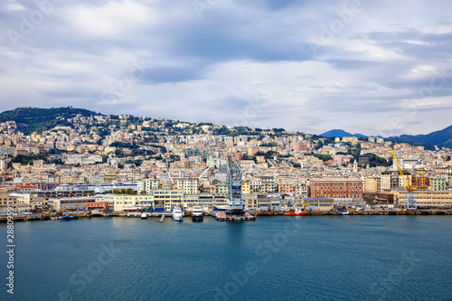 Fototapeta Naklejka Na Ścianę i Meble -  View of Genoa Genova city and port harbor with sea view and yachts, ships. Liguria region of Italy. On cloudy day from high angle