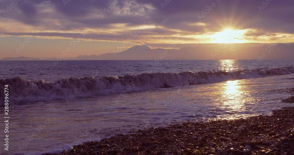 Beautiful sunset at beach with golden sun reflection on the sea Beautiful sunset at beach with golden sun reflection on the sea