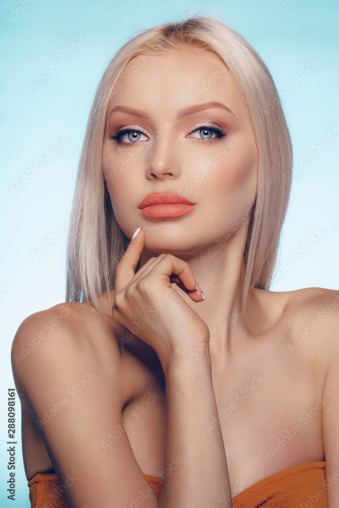 Close up beauty portrait of a blonde woman with perfect skin and plump lips Close up beauty portrait of a blonde woman with perfect skin and plump lips