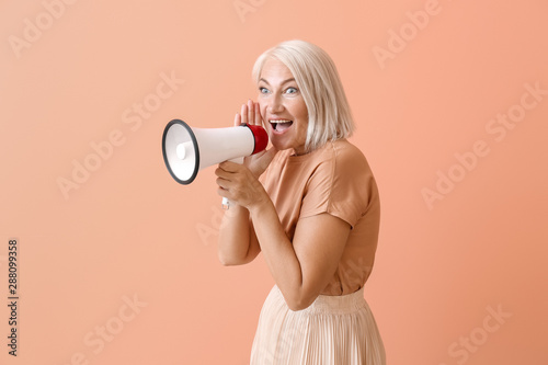 Mature woman with megaphone...