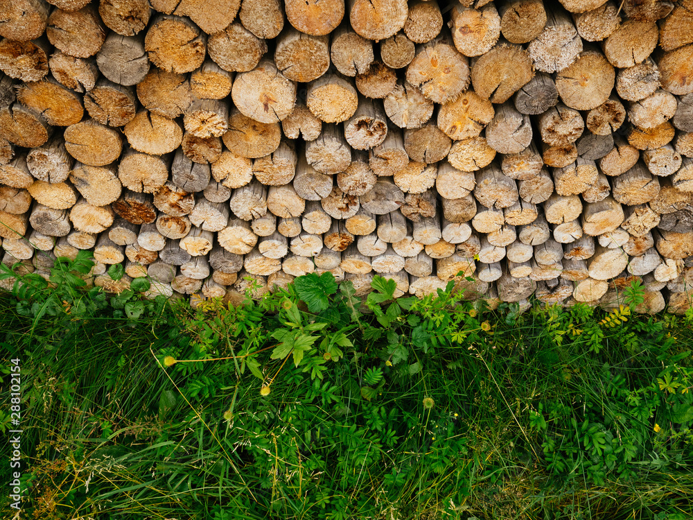 Neatly stacked firewood on top of each other Neatly stacked firewood on top of each other