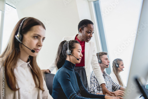 Fotografia Female supervisor working with team in call center