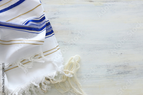 religion concept of White Prayer Shawl - Tallit, jewish religious symbol photo