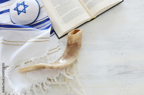 Photography religion image of Prayer Shawl - Tallit, Prayer book and Shofar (horn) jewish religious symbols
