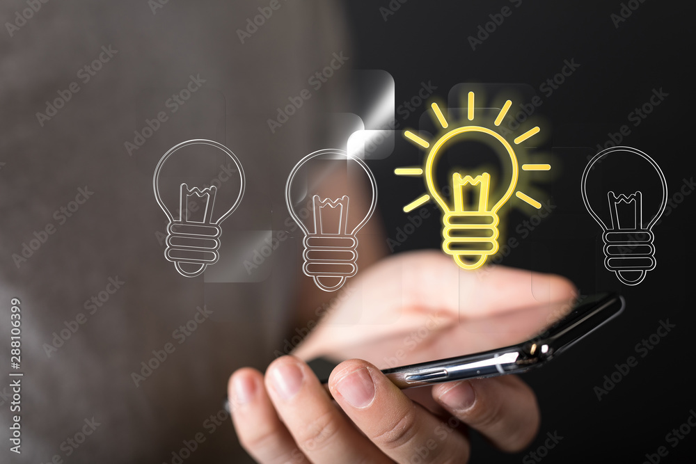 holding illuminated light bulb, idea, innovation and inspiration concept. holding illuminated light bulb, idea, innovation and inspiration concept.