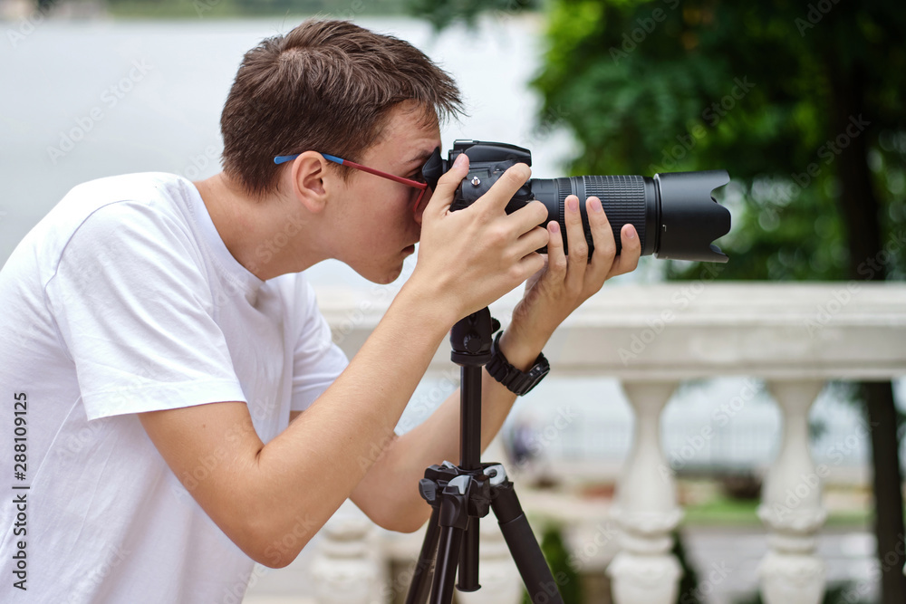 Man taking photos with a telephoto lens