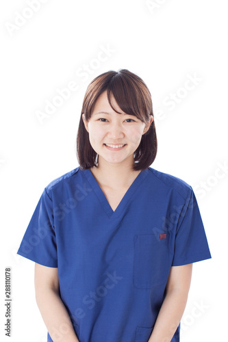 Young female nurse wearing scrub isolated on white background