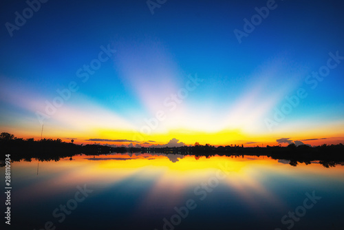 Beautiful summer sunset on the lake © comenoch