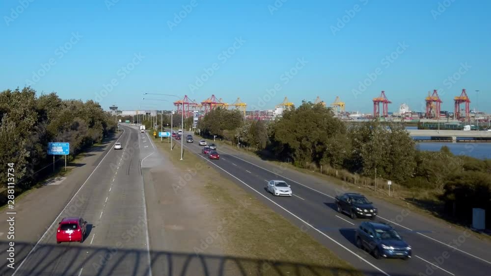 Timelapse of moderate traffic on the freeway from above