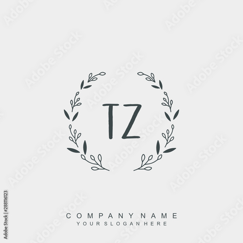 letter TZ surrounded by beautiful and elegant flowers and leaves. Wedding monogram logo template.