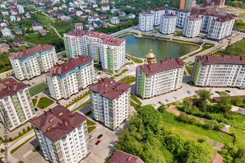 Top view of apartment or office tall buildings  parked cars  urban city landscape. Drone aerial photography.