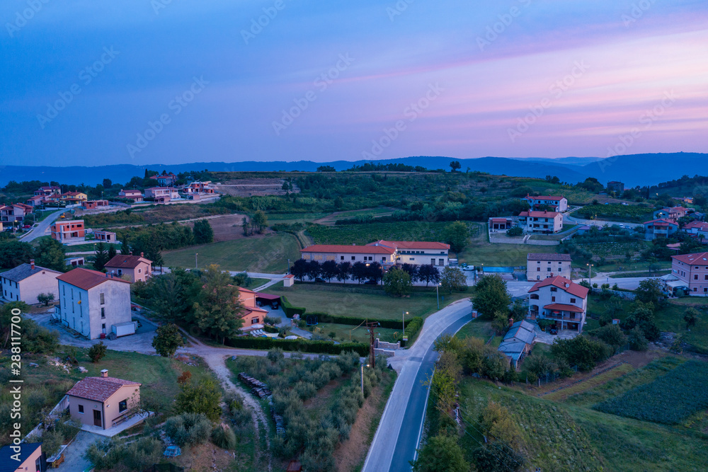 Morning landscape. Sunrise over a small village in the mountains. Istria, Croatia. The view from the top. Copy space.