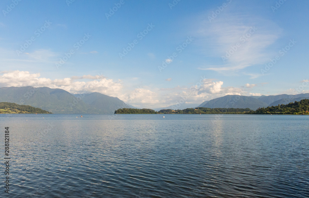 Serene panorama of the calm waters of Panguipulli Lake, from the village of Panguipulli. Patagonian area, Chile.