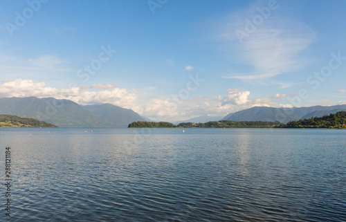 Serene panorama of the calm waters of Panguipulli Lake, from the village of Panguipulli. Patagonian area, Chile.