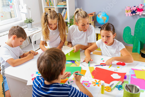Preschool Teacher with Children at Kindergarten - Creative Art Class