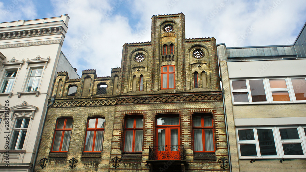 Fototapeta premium View of old brick house, beautiful architecture, sunny day, Lubeck, Germany