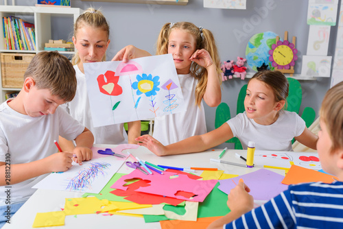 Preschool Teacher with Children at Kindergarten - Creative Art Class