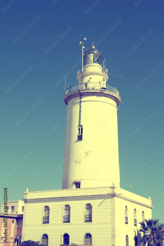 Malaga lighthouse. Spanish landmark. Retro filtered colors tone.