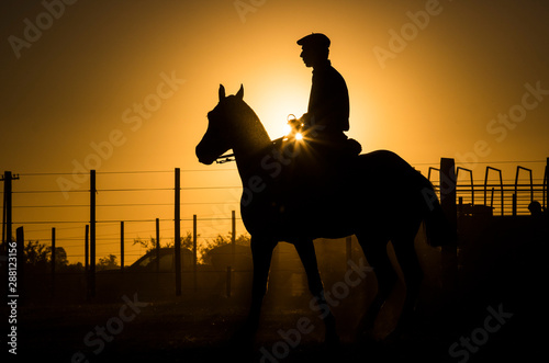 Gauchos / Cowboys  im Abendlicht photo