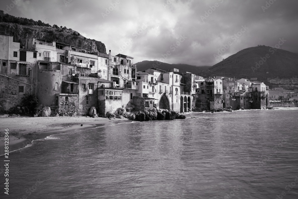 Sicily - Cefalu town beach. Black and white retro style.