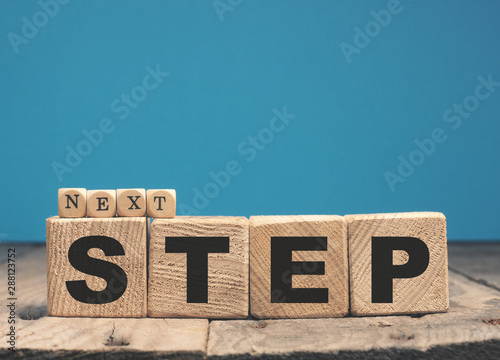 Naklejka Next step on wooden blocks
