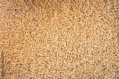 Wood pellets background/granules of compressed wood,  close up. Concept of cheap energy.