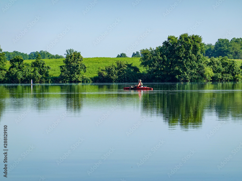 Person Kayaking in Lake
