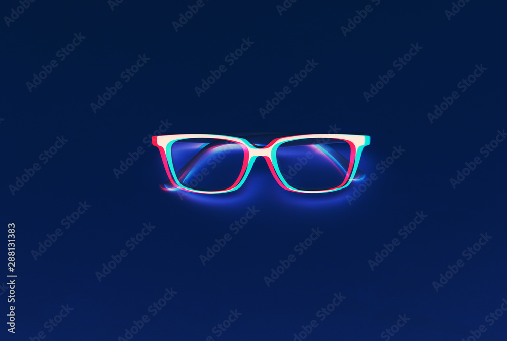Fashionable glasses on deep blue background. 3D effect. Glitch style effect. Vibrant duotone yellow, violet colors.