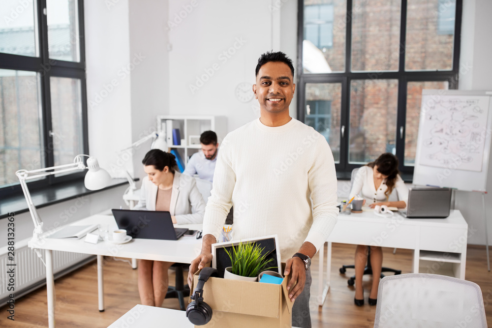 business, job and quit concept - happy smiling indian male office worker with personal stuff business, job and quit concept - happy smiling indian male office worker with personal stuff