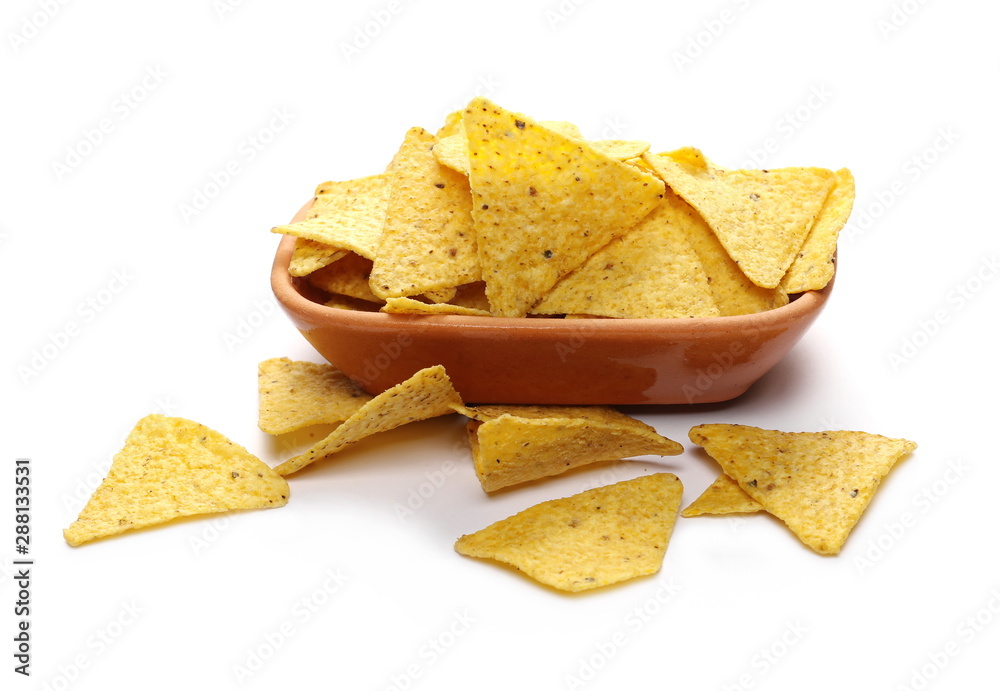Corn tortilla chips pile in clay pot, bowl isolated on white background Corn tortilla chips pile in clay pot, bowl isolated on white background