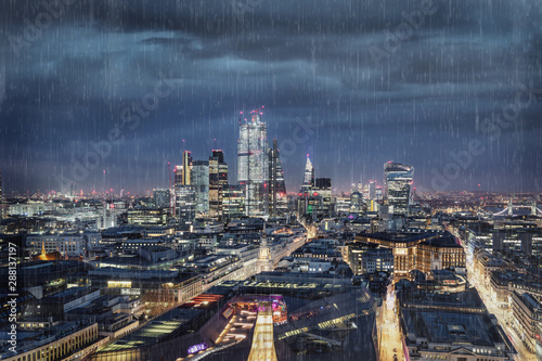 Photography Dark clouds and rain over the City of London, financial hub of United Kingdom