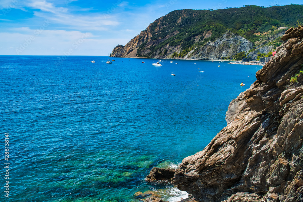 Mountainous coast of the Ligurian Sea / Mountain view, sea harbor with boats / Cinque Terre