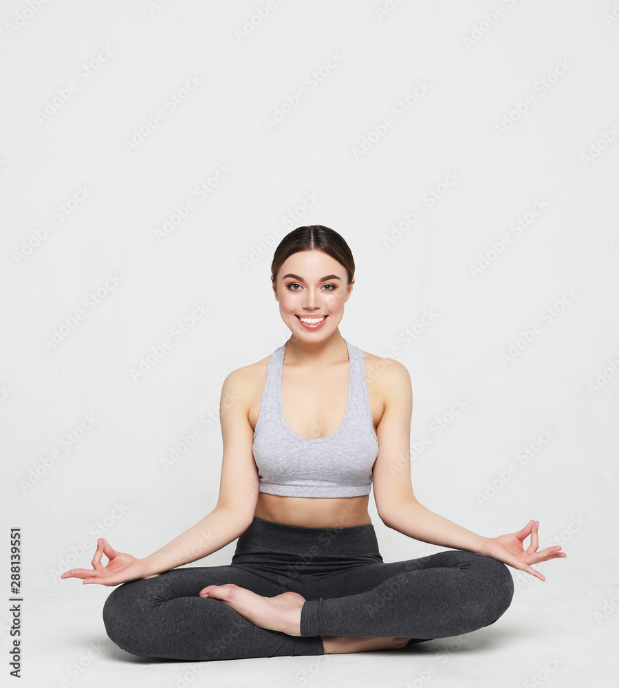 sport, yoga and people concept - lovely young woman doing yoga, sports exercises for relaxation and meditation sport, yoga and people concept - lovely young woman doing yoga, sports exercises for relaxation and meditation