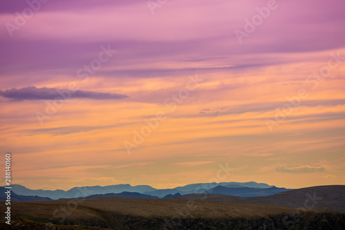 Mountain range in the early morning. Sunrise in mountains. Morning landscape with beautiful gradient sky