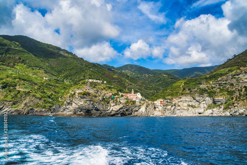 The rocky shore of Cinque Terre  overgrown with tropical greenery and vineyards. View from the sea  Monterosso al Mare  Italy