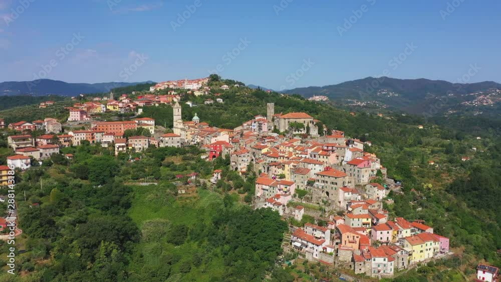 Flight by a drone. The ancient Italian town of Bolano Spezia is located on the mountain. Italy. Flight by a drone. The ancient Italian town of Bolano Spezia is located on the mountain. Italy.