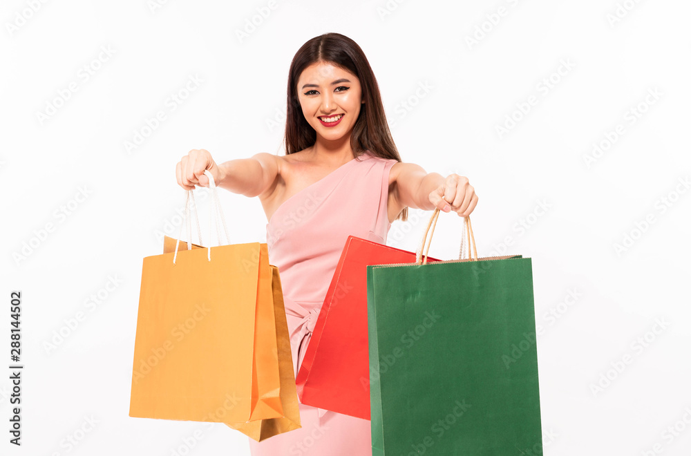 beautiful young happy asia woman holding bags shopping isolated on white beautiful young happy asia woman holding bags shopping isolated on white