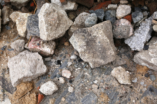 a lot of different stones for building a road on a city street
